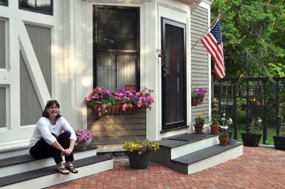Nancy Anderson outside of her Ocean Street carriage house. : “This house has been here for over a hundred years, it’s going to stay here for another hundred.”Jennifer Smith photo